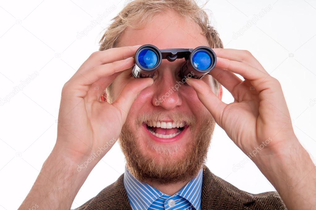 Excited man watching through binoculars