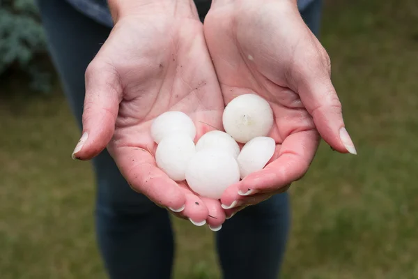 Hail in hands — Stock Photo, Image