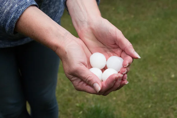 Hail in hands — Stock Photo, Image