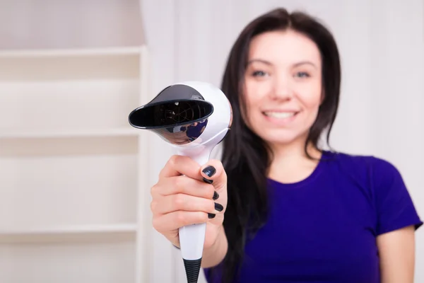 Young girl with hair dryer — Stock Photo, Image