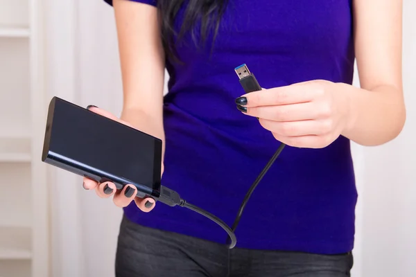 Portable hard drive in hands — Stock Photo, Image