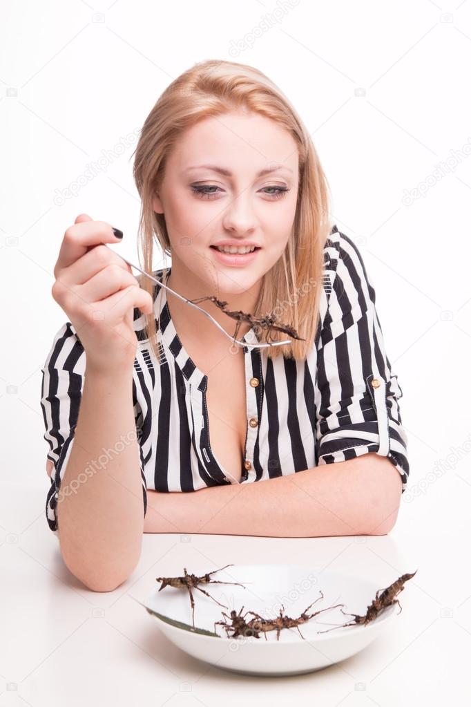 woman eating insects with
