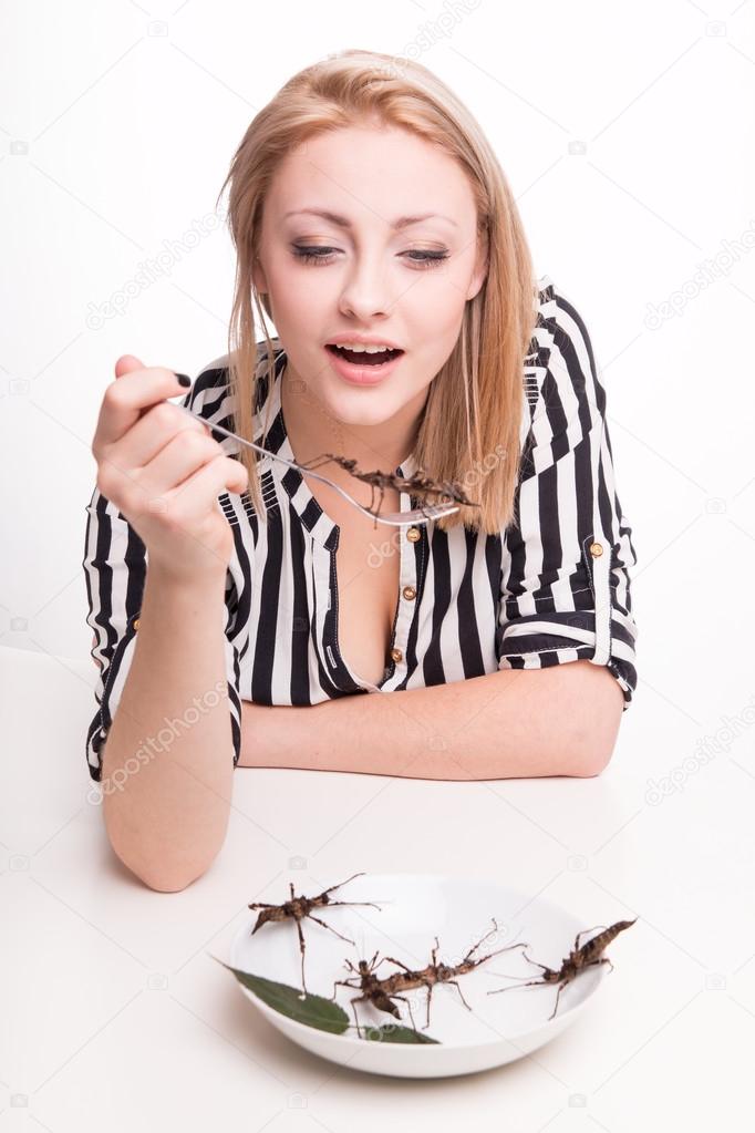 woman eating insects with