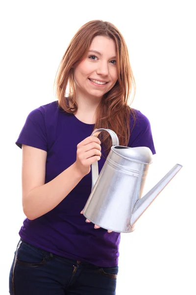 Young woman watering flowers — Stock Photo, Image