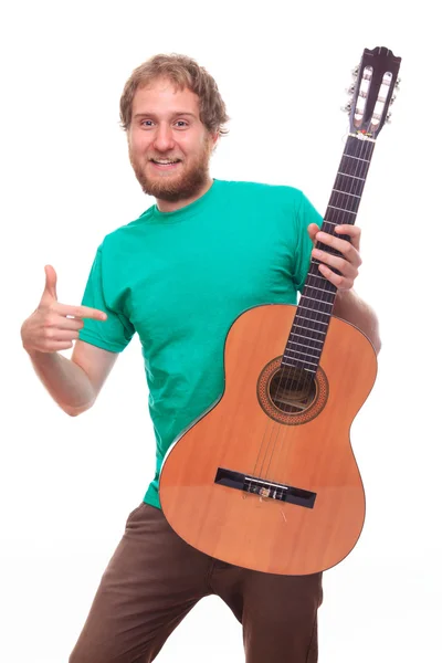 Vousatý muž s kytarou — Stock fotografie