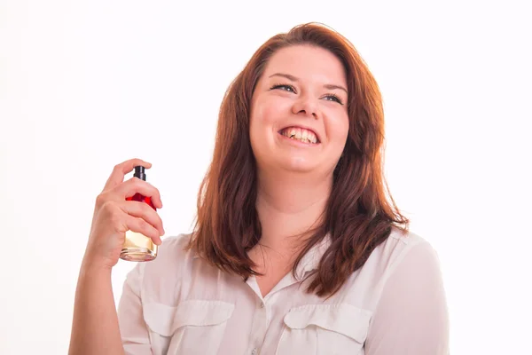 Smiling girl using perfume — Stock Photo, Image