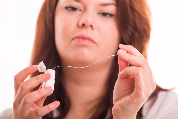 Woman using dental thread — Stock Photo, Image
