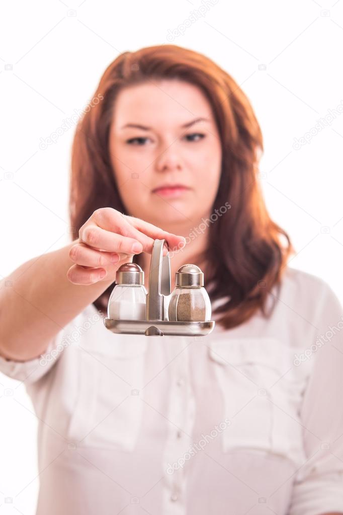 girl  holding salt and pepper