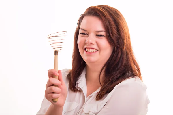 Woman holding egg whisk — Stock Photo, Image