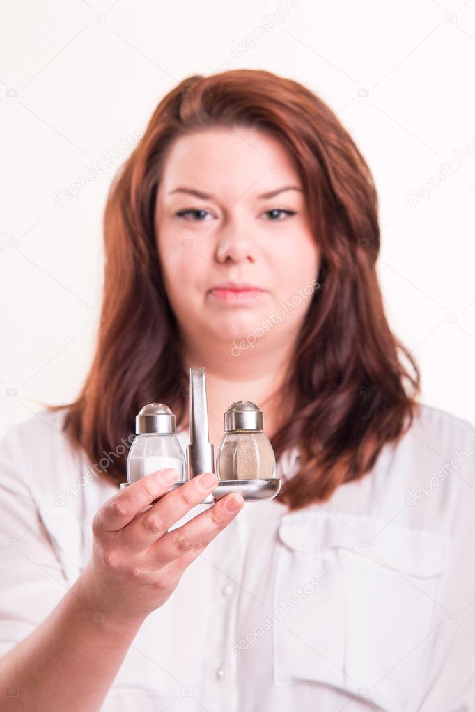 girl  holding salt and pepper