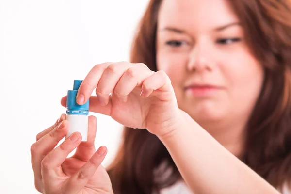 Woman opening eye drops — Stock Photo, Image