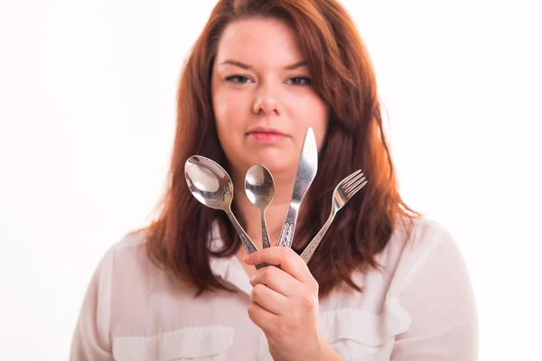 Housewife holding cutlery set — Stock Photo, Image
