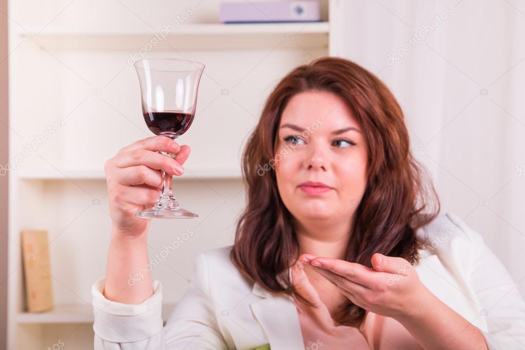 Elegant woman drinking wine