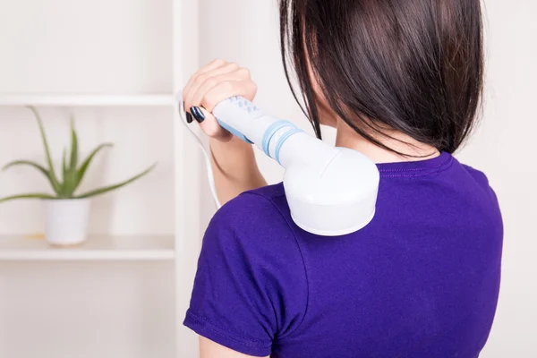 Electronic back massage at home — Stock Photo, Image