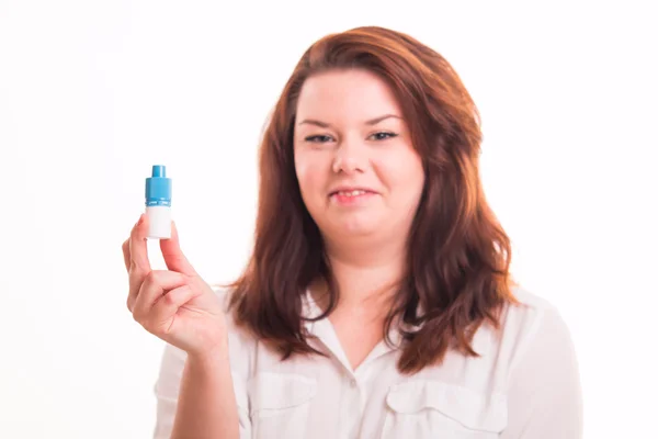 Woman holding eye drops — Stock Photo, Image