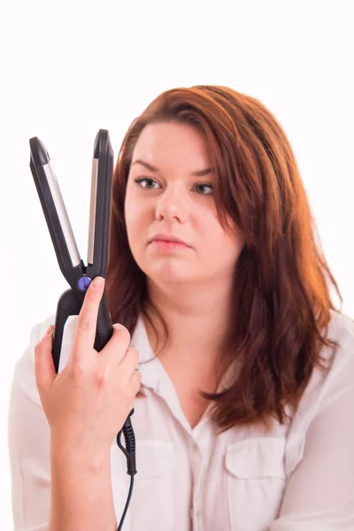 Woman trying to straighten hair — Stock Photo, Image