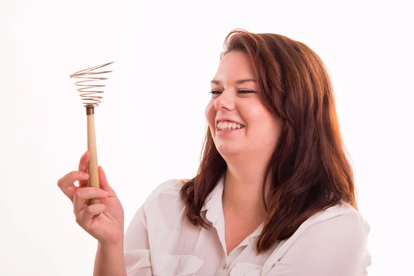 Woman holding egg beater — Stock Photo, Image