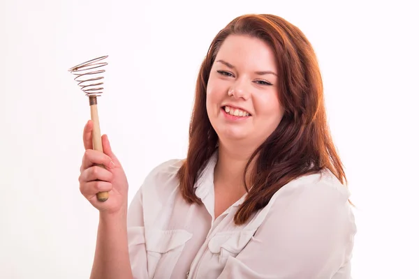 Woman holding egg beater — Stock Photo, Image