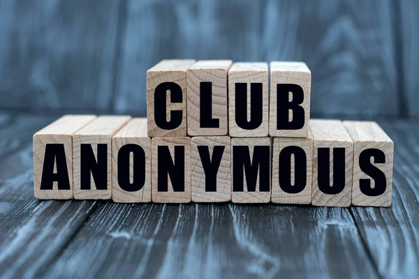 concept of words to club anonymous on cubes on a beautiful wooden background