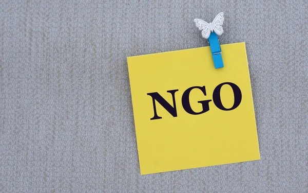 Ngo Non Governmental Organization Word Yellow Paper Clothespin Gray Background — Stock Photo, Image