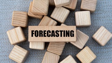 FORECASTING - word on wooden bars on cubes on a gray background. Business and concept