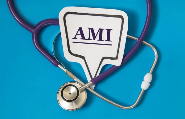 AMI (Acute Myocardial Infarction) - acronym on white figure sheet on a blue background with a stethoscope. Medical concept