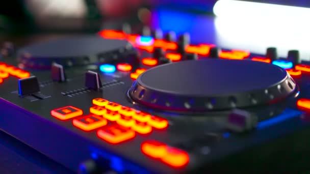 Musical equipment, DJ mixer on table at night club — Stock Video