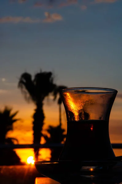 Glass Turkish Tea Blurred Background Sunset Silhouettes Palm Trees Beautiful — Photo