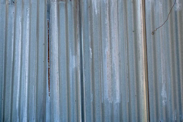 Gray sheets of tin. Gray background with rust and iron