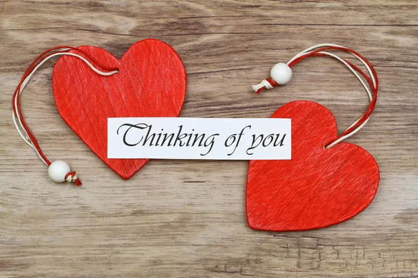 Thinking of you card with two red wooden hearts — Stock Photo, Image