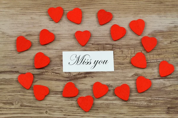 Miss you card with little red wooden hearts — Stock Photo, Image