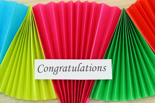 Congratulations card on colorful rainbow fan — Stock Photo, Image