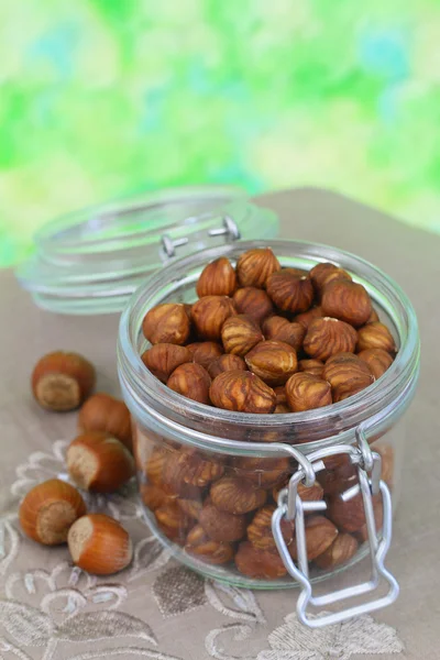 Whole hazelnuts in vintage glass jar, close up — Stock Photo, Image