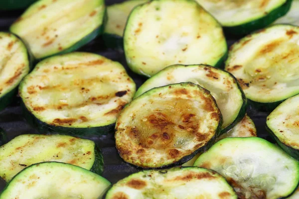 Fried courgette slices in frying pan — Stock Photo, Image