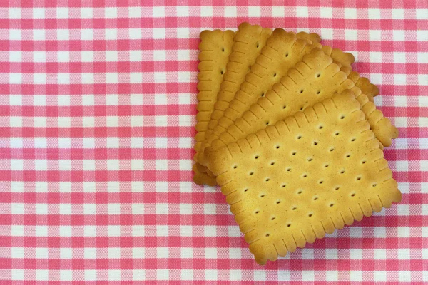 经典松脆饼干上有粉红色格仔布带副本空间 — 图库照片