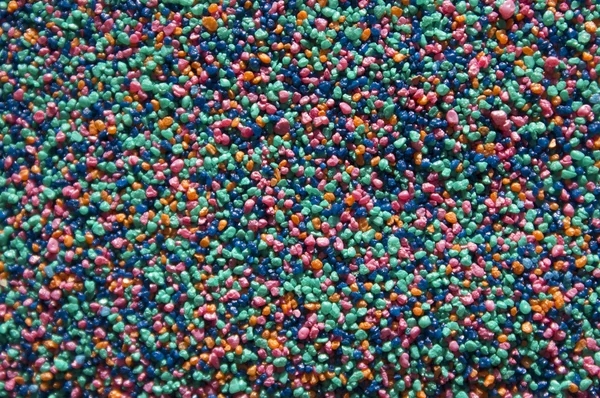 Abstraktní pozadí světlé písek barevné granule jsou malé — Stock fotografie