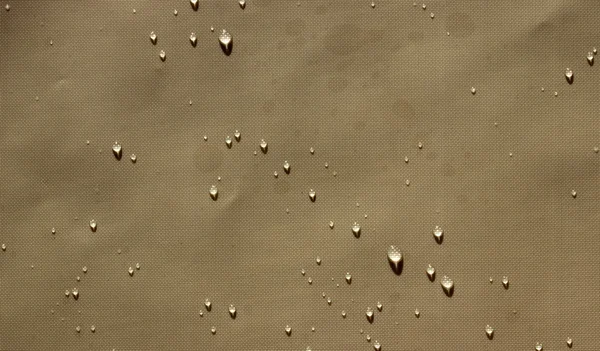 brown slippery water droplets background burnt nylon