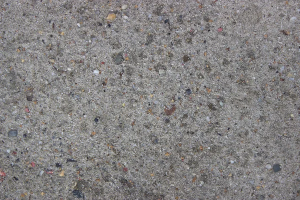 Homokos föld textúra háttér-val egy durva utca — Stock Fotó