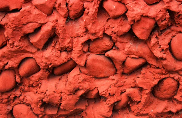     Kırmızı taşlar arka plan soyut taş duvar 