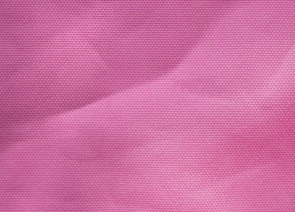 Fundo tecido sintético malha rosa — Fotografia de Stock