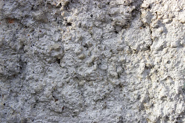 Szorstki tło kamień stary mur cementu z pęknięć — Zdjęcie stockowe