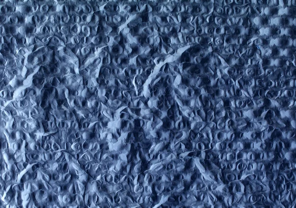 Ciemny niebieski tło tłoczone placu — Zdjęcie stockowe