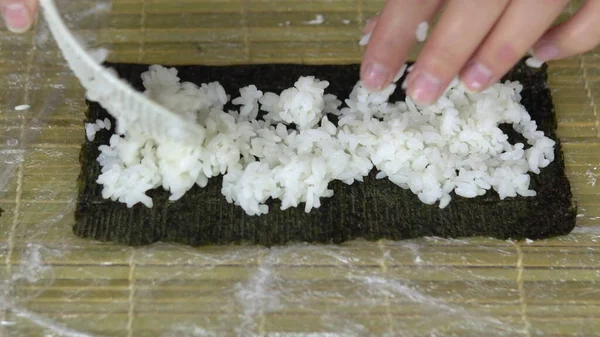 Woman Puts Rice Nori Leaf Cooking Sushi Home Close Shot — Stock Photo, Image