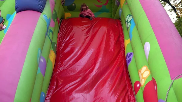 Girl Rides Inflatable Slide Playground — Stock Photo, Image