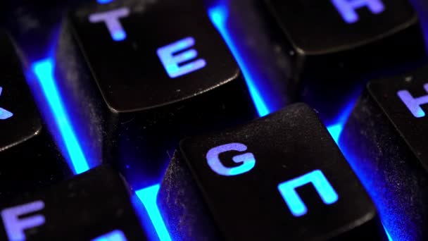 Multiple keyboard keys changing colors close-up — Stock Video