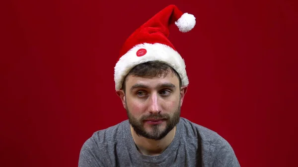 Man Sitting Christmas Hat Dancing His Head Santa Bearded Helper — Stock Photo, Image