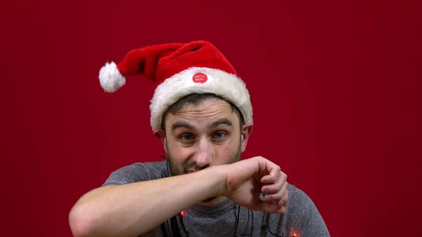 Man Sitting Christmas Hat Dancing His Head Santa Bearded Helper — Stock Photo, Image