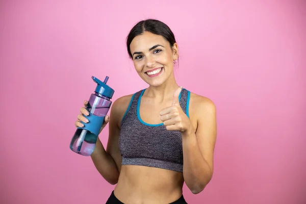 Jonge Mooie Vrouw Draagt Sportkleding Geïsoleerde Roze Achtergrond Wijzen Duim — Stockfoto