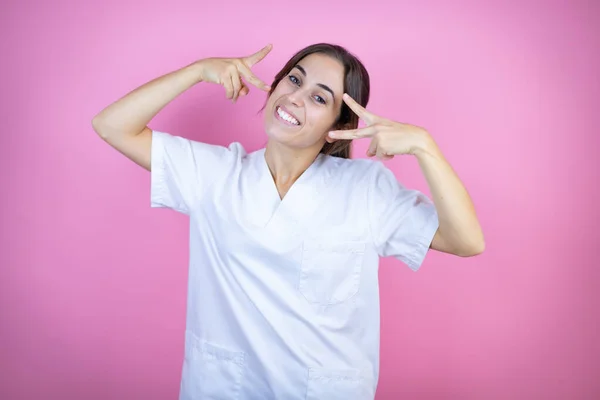 Young Brunette Doctor Girl Wearing Nurse Surgeon Uniform Isolated Pink — Foto Stock