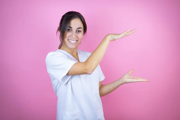 Young Brunette Doctor Girl Wearing Nurse Surgeon Uniform Isolated Pink — Foto Stock